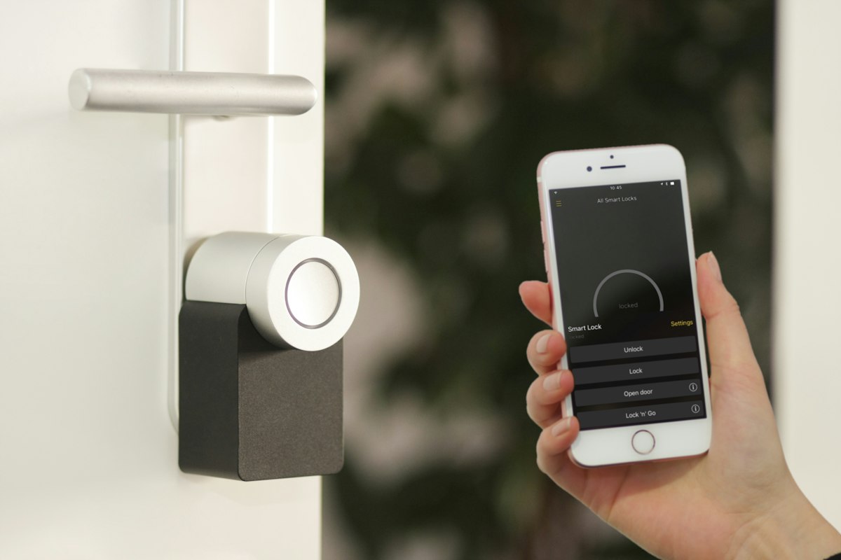 Smart door lock being opened with a phone