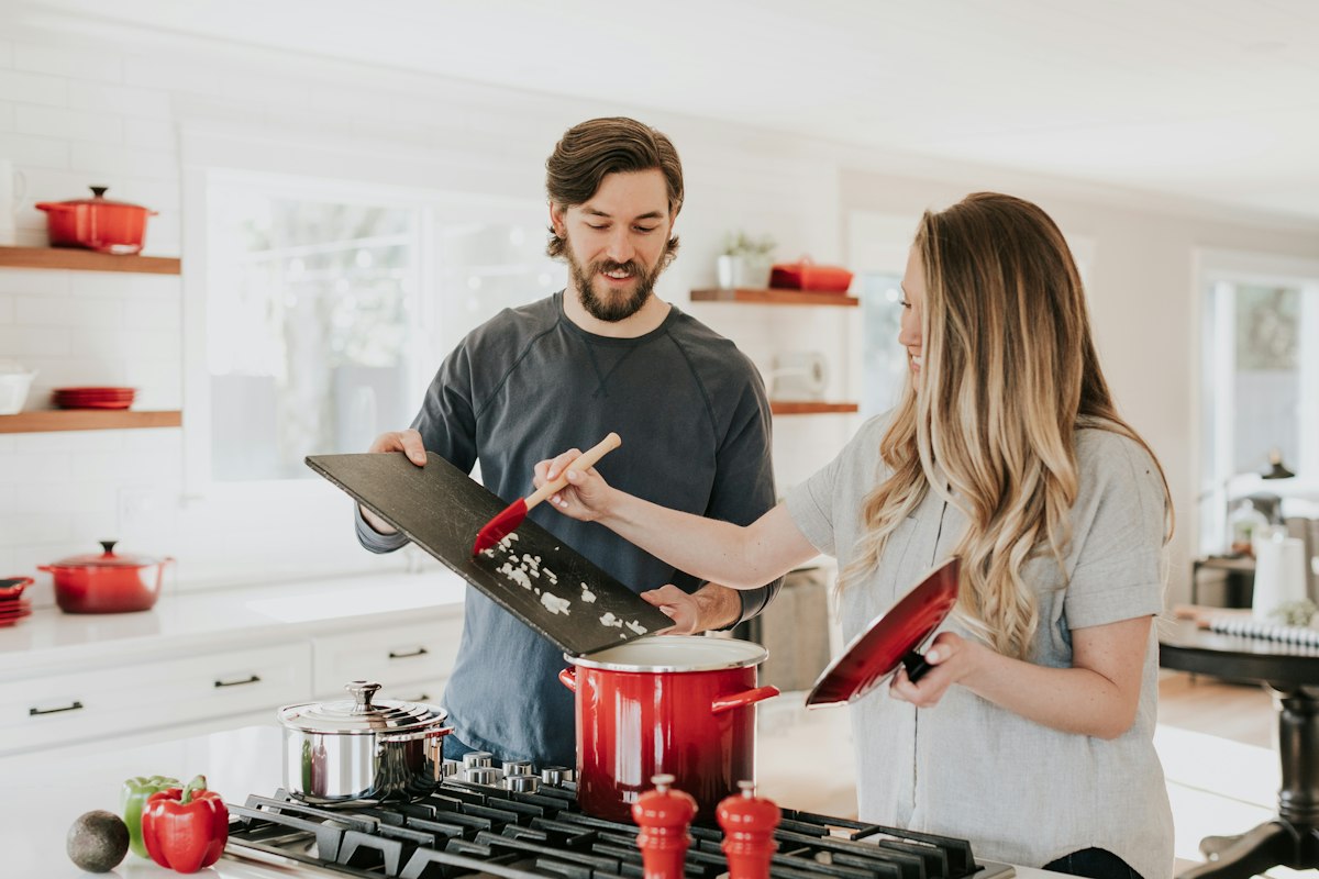 Couple cooking together in their kitchen