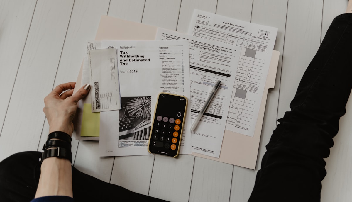 Policy paperwork and a calculator on a desk